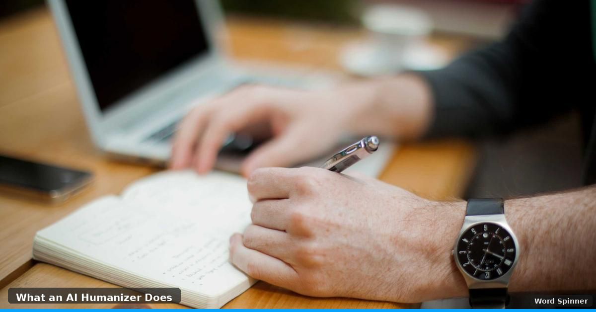 Person writing in notebook with laptop open on wooden desk